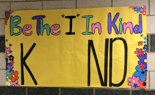 NHS members encourage students to take a picture of themselves in the missing “I” which will be shared on the official NHS Instagram page for Random Act of Kindness day.