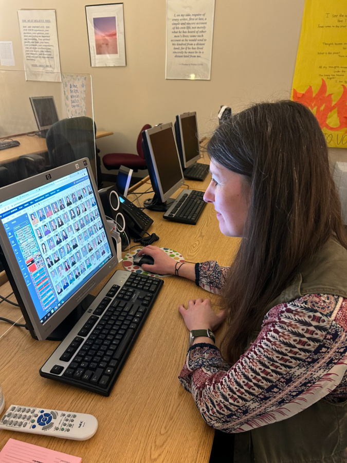 Yearbook adviser Jen Stevenson looks through the student section of the yearbook, as she helps finish that section of the 192-page book. Stevenson said, I like making a quality book for the students and families of Mayfield to enjoy.”