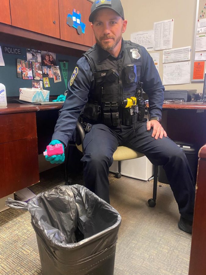 School Resource Officer Andrew Duffy disposes of a confiscated vape. Junior class vice president Eric Bozkurt wants school officials to take a harder stance against vaping in the school. Bozkurt said, “The best option would be to enforce the no vaping more often. Instead of using announcements they should take action and enforce the rule.”